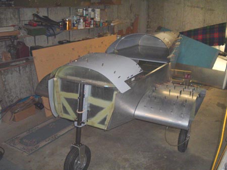 Fuselage with turtledeck and brake lines